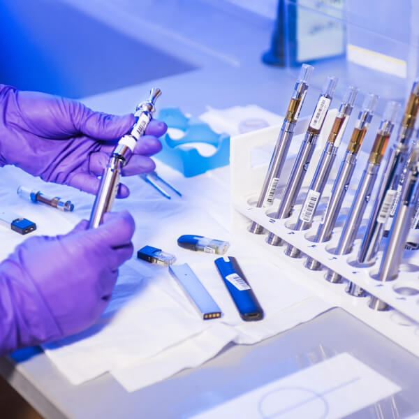 Scientist handling laboratory equipment for fertility research